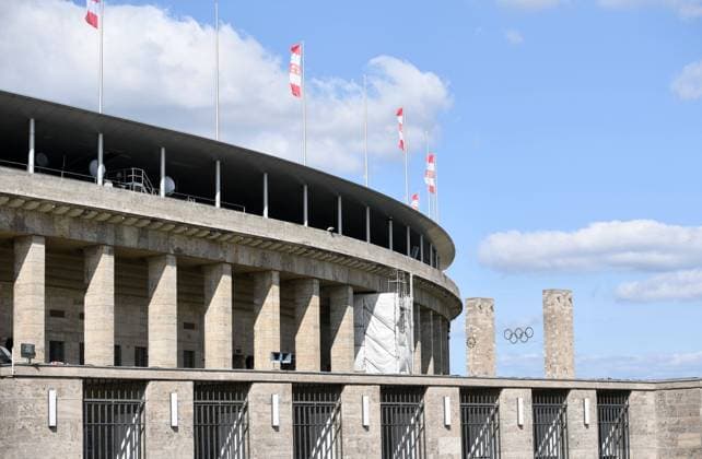 Football, Men, 2021 2022 season, Play offs to Europa Conference League second leg , 1 FC Union Berlin Kuopion PS, 2 days before the match the Olympiastadion will be draped in the red and white club colours of Union, in the picture Union flags were hoisted on the roof of the Olympiastadion, 24 08 2021, Copyright: xSebastianxRäppold MatthiasxKochx