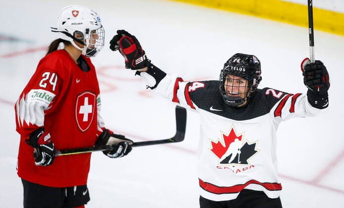 August 24, 2021, Calgary, ab, Canada: Canada s Natalie Spooner, right, celebrates a goal as Switzerland s Noemi Ryhner skates away during third period IIHF Women s World Championship, WM, Weltmeisterschaft hockey action in Calgary, Tuesday, Aug. 24, 2021. Natalie Spooner, Noemi Ryhner  - ZUMAc35_ 20210824_zaf_c35_096 Copyright: xJeffxMcintoshx