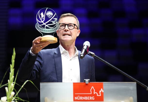 25 08 2021 Basketball Nuremberg Falcons Basketball Club NBC Official inauguration of the Kia Metropol Arena Sports photo Zink DaMa Ralf Schekira Chairman of the Supervisory Board of wbg Nuremberg holds up sympolic handover of keys in the form of a basketball trophy