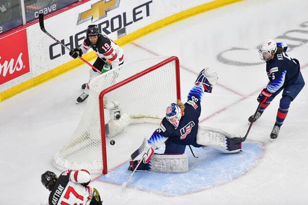 August 26, 2021, Calgary, AB, Canada: Canada s JAMIE RATTRAY (bottom left) scores on ALEX CAVALLINI (centre right) from The United States while Canada s BRIANNE JENNER (centre left) and MEGAN KELLER (right) from The United States look on during the Canada vs United States preliminary round game at the 2021 IIHF Women s World Championship, WM, Weltmeisterschaft in Calgary, AB, Canada on 26 August, 2021. Canada defeated the United States 5-1 to take first place in the preliminary round. The last time Canada beat the United States at the World Championship was in 2013. Calgary Canada - ZUMAj113 0131780626st Copyright: xGavinxJohnx