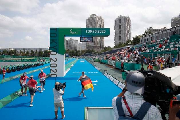 TOKIO SHINJUKU KU , JAPAN AUGUST 29 Martin Schulz GER with German flag wins the gold medal on day 5 of the Tokyo 2020 Paralympic Games during the Para Triathlon Men s PTS5 Final at Odaiba Marine Park on 29 8 2021 in Tokyo to Japan Joachim Sielski Paralympics 2020 Final Triathlon
