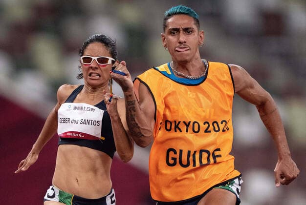 August 30, 2021, Tokyo, Japan: Jerusa Geber Dos Santos BRA and her guide Gabriel Aparecido Dos Santos Garcia BRA compete in the WoMen s 100m T11 Semi-Final in the Athletics at the Olympic Stadium. Tokyo 2020 Paralympic Games. (Photo: Bob Martin). Tokyo Japan - ZUMAz03_ 20210830_swp_z03_810 Copyright: xOISx