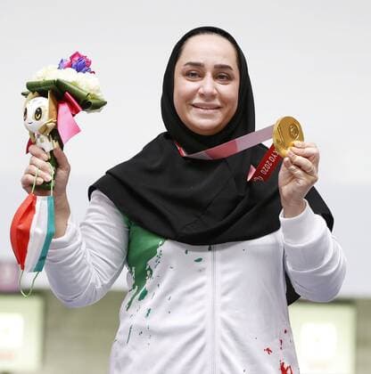 Tokyo Paralympics: Shooting Sareh Javanmardi of Iran celebrates with her gold medal for the women s shooting 10-meter air pistol SH1 event at the Tokyo Paralympics at Asaka Shooting Range in Tokyo on Aug. 31, 2021.  A14AA0000790638P