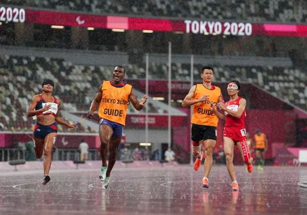 (210831) -- TOKYO, Aug. 31, 2021 -- China s Liu Cuiqing (1st R) and her guide Xu Donglin (2nd R) react after the women s T11 class 100m final of athletics event at the Tokyo 2020 Paralympic Games in Tokyo, Japan, Aug. 31, 2021. ) (TOKYO2020)JAPAN-TOKYO-PARALYMPICS-ATHLETICS-WOMEN S 100M T11-FINAL HuxHuhu 