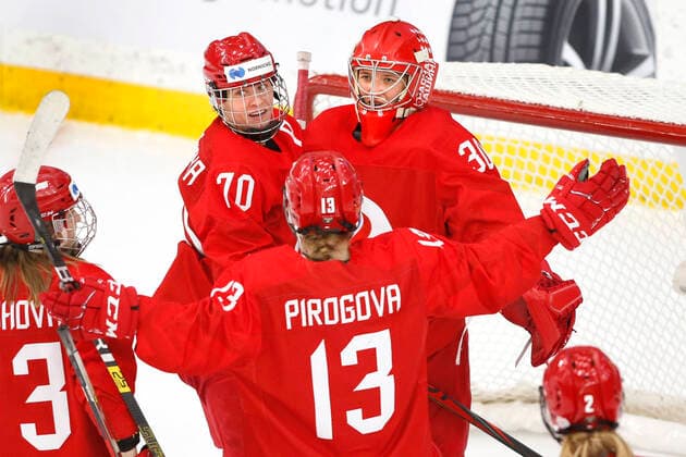 ROC (Russian Olympic Committee) goalie Valeria Merkusheva, top rt, and teammates celebrate a 2-0 shutout victory over Japan for a 5th place tournament placing after IIHF Women s World Championship, WM, Weltmeisterschaft play in Calgary, Alberta, Canada on Aug. 31, 2021. digital photo by Larry MacDougal Valeria Merkusheva