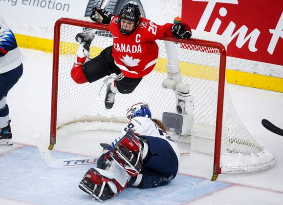 August 31, 2021, Calgary, ab, Canada: Canada s Marie-Philip Poulin, top, hangs from the cross bar after crashing into goalie Nicole Hensley, of the United States, during third period gold medal final IIHF Women s World Championship, WM, Weltmeisterschaft hockey action in Calgary, Tuesday, Aug. 31, 2021. Marie-Philip Poulin, Nicole Hensley, - ZUMAc35_ 20210831_zaf_c35_089 Copyright: xJeffxMcintoshx