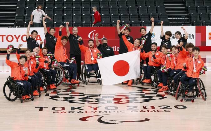 Tokyo Paralympics: Wheelchair Basketball Japan players pose with their silver medals after the awarding ceremony for the men s wheelchair basketball at the Tokyo Paralympics on Sept. 5, 2021, at Ariake Arena in Tokyo.  A14AA0000825503P