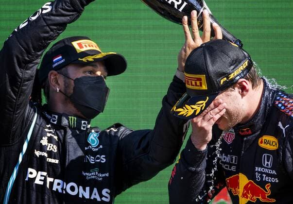 ZANDVOORT Max Verstappen Red Bull Racing celebrates winning the Dutch Grand Prix at the Zandvoort circuit together with Lewis Hamilton Mercedes KOEN VAN WEEL Grand Prix xVIxANPxSportx xxANPxIVx 436908957