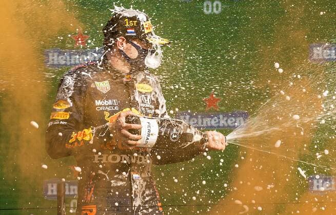 ZANDVOORT Max Verstappen Red Bull sprays champagne on the podium after winning the Dutch Grand Prix at the Zandvoort circuit REMKO DE WAAL Grand Prix xVIxANPxSportx xxANPxIVx 436910016