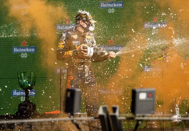 ZANDVOORT Max Verstappen Red Bull sprays champagne on the podium after winning the Dutch Grand Prix at the Zandvoort circuit REMKO DE WAAL Grand Prix xVIxANPxSportx xxANPxIVx 436910025
