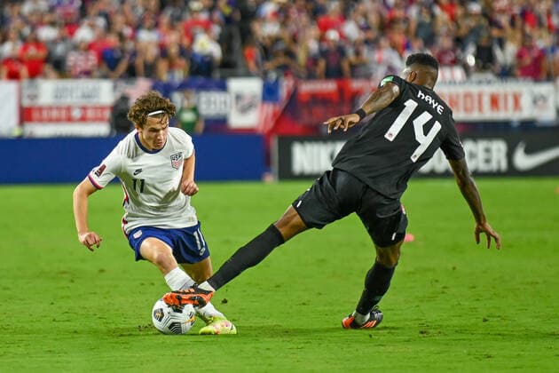 NASHVILLE, TN - SEPTEMBER 05: US forward, Brenden Aaronson (11), works the ball past Canada midfielder, Mark-Anthony Kaye (14), during the World Cup qualifying match between Canada and the United States on September 5, 2021 at Nissan Stadium in Nashville, TN. (Photo by Kevin Langley Icon Sportswire) SOCCER: SEP 05 USA v Canada Icon2109051431