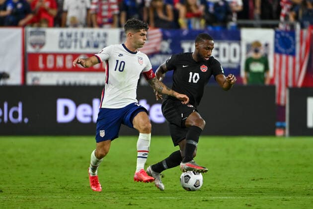 NASHVILLE, TN - SEPTEMBER 05: US forward, Christian Pulisic (10) and Canada forward, David Junior Hoilett (10), battle for control of the ball during the World Cup qualifying match between Canada and the United States on September 5, 2021 at Nissan Stadium in Nashville, TN. (Photo by Kevin Langley Icon Sportswire) SOCCER: SEP 05 USA v Canada Icon2109051440