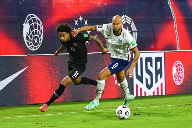 NASHVILLE, TN - SEPTEMBER 05: Canada forward, Tajon Buchanan (11), battles with US defender, John Brooks (6), during the World Cup qualifying match between Canada and the United States on September 5, 2021 at Nissan Stadium in Nashville, TN. (Photo by Kevin Langley Icon Sportswire) SOCCER: SEP 05 USA v Canada Icon2109051442