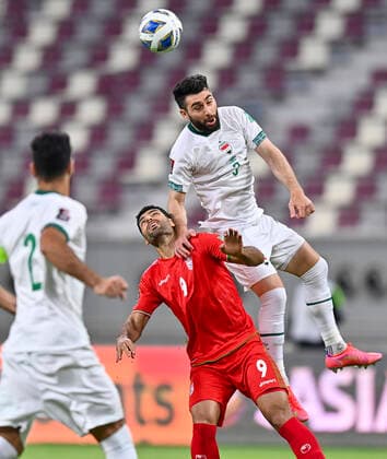 (210908) -- DOHA, Sept. 8, 2021 -- Mehdi Taremi (bottom, R) of Iran vies with Frans Dhia Putros (top) of Iraq during the FIFA World Cup, WM, Weltmeisterschaft, Fussball qualifier match between Iran and Iraq in Doha, Qatar, Sept. 7, 2021. (Photo by Xinhua) (SP)QATAR-DOHA-FOOTBALL-2022 FIFA WORLD CUP QUALIFIER-IRAN VS IRAQ Nikku 
