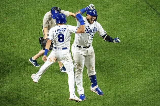 Kansas City Royals catcher Salvador Perez (13) celebrates with second baseman Nicky Lopez (8) after hitting a three run home run to take the lead against the Oakland Athletics in the sixth inning at Kauffman Stadium in Kansas City, Missouri on Tuesday, September 14, 2021.  KCP20210914124 KYLExRIVAS