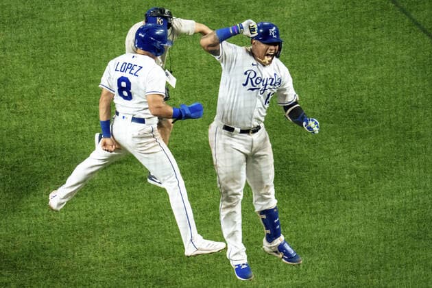 Kansas City Royals catcher Salvador Perez (13) celebrates with second baseman Nicky Lopez (8) after hitting a three run home run to take the lead against the Oakland Athletics in the sixth inning at Kauffman Stadium in Kansas City, Missouri on Tuesday, September 14, 2021.  KCP20210914125 KYLExRIVAS