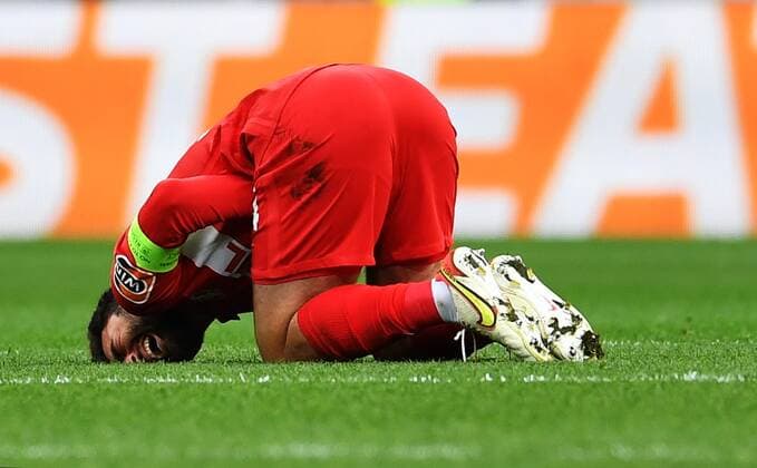 6651406 15.09.2021 Spartak s Georgi Dzhikiya lies on the pitch suffering after a collision during the Europa League soccer match between Spartak Moscow and Legia Warsaw, in Moscow, Russia. Pavel Bednyakov Sputnik Russia Soccer Europa League Spartak - Legia  b53e02a90404a989