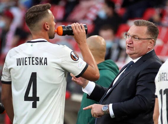 MOSCOW, RUSSIA â€“ SEPTEMBER 15, 2021: FC Legia Warsaw s head coach Czeslaw Michniewicz (R) instructs Mateusz Wieteska in their 2021 22 UEFA Europa League Group C football match against FC Spartak Moscow, at Otkrytie Arena Stadium. Sergei Fadeichev TASS  TS11085C