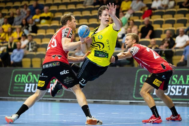 210915 IFK Ystads Marius Ferkingstad and Filip Langh try to stop Sävehofs Elias Ellefsen in Skipagotu during the handball match in the Handball League between Sävehof and IFK Ystad on 15 September 2021 in Partille,  Copyright: MICHAELxERICHSEN BB210915MI096