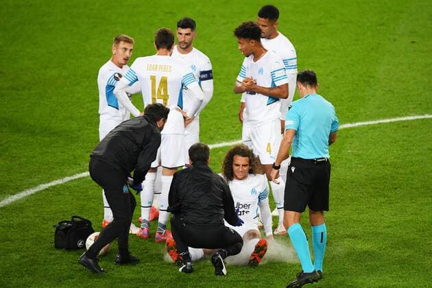 6652373 16.09.2021 Marseille s Matteo Guendouzi reacts in pain during the Europa League soccer match between Lokomotiv Moscow and Olympique de Marseille, in Moscow, Russia. Ramil Sitdikov Sputnik Russia Soccer Europa League Lokomotiv - Marseille  739bf0b20373414c