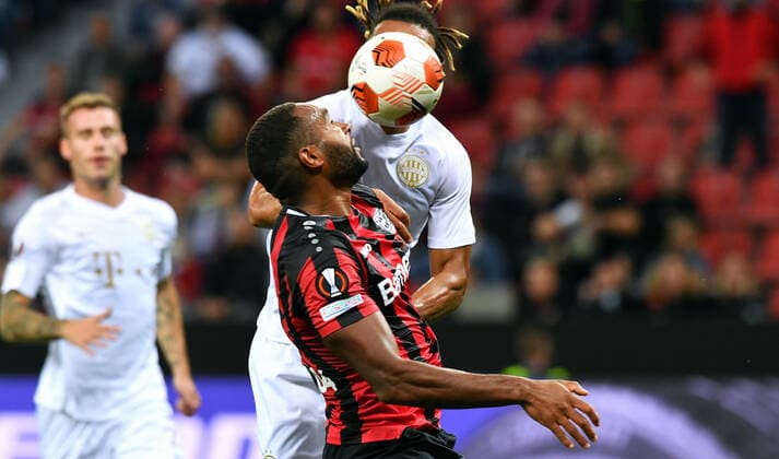 Football, UEFA Europa League, Men, 2020 2021 season, Group G, Matchday 1, BayArena Leverkusen, Bayer Leverkusen red Ferencvaros Budapest white Jonathan Tah LEV , Samy Mmaee BUD Action UEFA REGULATES PROHIBIT ANY USE OF PHOTOGRAPHS AS IMAGE SEQUENCES AND OR QUASI VIDEO