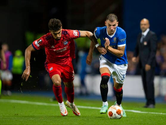 Football - 2021 2022 UEFA Europa League - Group A, Round One - Glasgow Rangers vs Lyon - Ibrox stadium - Thursday 16th September 2021 Borna Barasic of Rangers vies with Lucas Paqueta of Olympique Lyonnais 