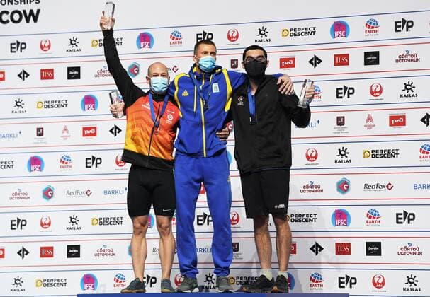 6652618 16.09.2021 From left, silver medalist Spain s Erik Noya Cardona, gold medalist Ukraine s Danyil Boldyrev and bronze medalist Noah Bratschi, of the United States, celebrate on the podium during the awarding ceremony for men s speed competition at Climbing World Championships, in Moscow, Russia. Pavel Bednyakov Sputnik Russia Climbing World Championships Speed  a892bfa2b49833ab