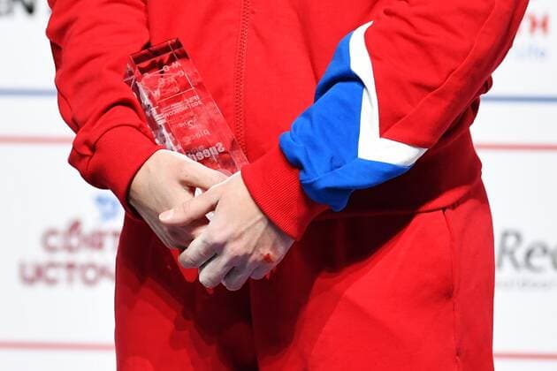 6652624 16.09.2021 Silver medalist Russia s Iuliia Kaplina celebrates on the podium during the awarding ceremony for the women s speed competition at Climbing World Championships, in Moscow, Russia. Pavel Bednyakov Sputnik Russia Climbing World Championships Speed  a9f7dc5a9c29324b