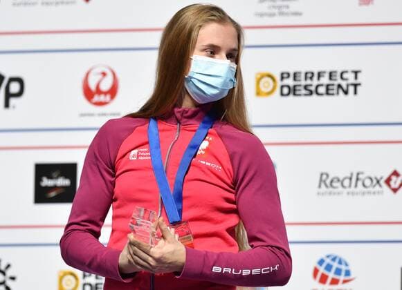6652633 16.09.2021 Gold medalist Poland s Natalia Kalucka celebrates on the podium during the awarding ceremony for women s speed competition at Climbing World Championships, in Moscow, Russia. Pavel Bednyakov Sputnik Russia Climbing World Championships Speed  2f0cc3a7a884cac6