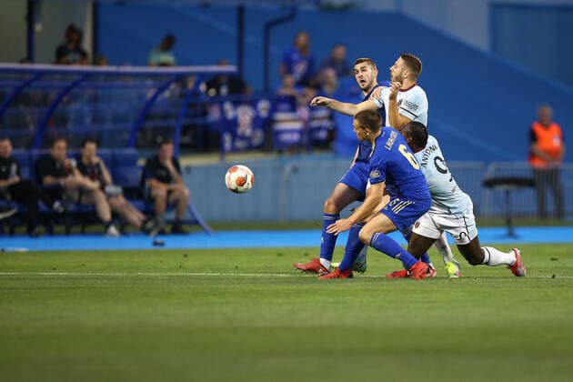 PXL_Dinamo Zagreb v West Ham United: Group H - UEFA Europa League ZAGREB, CROATIA - SEPTEMBER 16: Rasmus Lauritsen of Dinamo Zagreb in action with Nikola Vlasic of West Ham United during the UEFA Europa League group H match between Dinamo Zagreb and West Ham United at Maksimir Stadium on September 16, 2021 in Zagreb, Croatia. MatijaxHabljak PIXSELL
