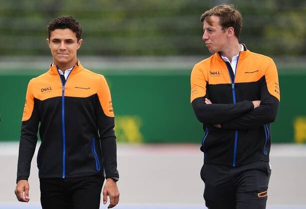 6657270 23.09.2021 British Formula One driver Lando Norris of McLaren walks with team members during preparations for the 2021 Formula One Russian Grand Prix, at the Sochi Autodrom racing circuit, in Sochi, Russia. Formula One Russian Grand Prix will be held in Sochi from 24 to 26 September. Vladimir Astapkovich Sputnik Russia Motor Formula 1 Preparations  8dfc56fa55dcc5ae