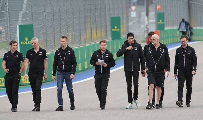 SOCHI, RUSSIA - SEPTEMBER 23, 2021: Alpine driver Esteban Ocon (5th L) and his teammates walk along the pit lane and the racing track ahead of the 2021 Formula One Russian Grand Prix to be held in Sochi on September 24-26, 2021, at the Sochi Autodrom racing circuit. Sergei Fadeichev TASS  TS11193C