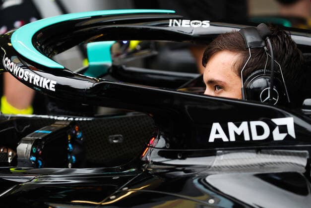 SOCHI, RUSSIA - SEPTEMBER 23, 2021: A car mechanic of Mercedes AMG Petronas carries out maintenance of a car ahead of the 2021 Formula One Russian Grand Prix to be held in Sochi on September 24-26, 2021, at the Sochi Autodrom racing circuit. Sergei Fadeichev TASS  TS111995