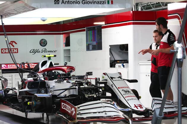 SOCHI, RUSSIA - SEPTEMBER 23, 2021: Alfa Romeo Racing car mechanics are seen ahead of the 2021 Formula One Russian Grand Prix to be held in Sochi on September 24-26, 2021, at the Sochi Autodrom racing circuit. Sergei Fadeichev TASS  TS1119B8