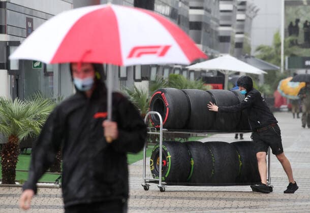 SOCHI, RUSSIA - SEPTEMBER 25, 2021: A member of the Scuderia Ferrari team moves tires in a paddock area at the Sochi Autodrom racing circuit hosting the 2021 Formula One Russian Grand Prix. The third practice session of the 2021 F1 Russian Grand Prix has been canceled amid heavy rains in Sochi. Sergei Fadeichev TASS  TS111DE9