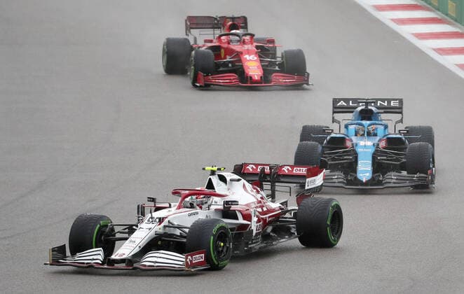 SOCHI, RUSSIA â€“ SEPTEMBER 25, 2021: Alfa Romeo Racing F1 Team driver Antonio Giovinazzi of Italy, Alpine F1 Team driver Fernando Alonso of Spain, and Scuderia Ferrari F1 driver Charles Leclerc of Monaco, from left, compete in a qualifying session for the 2021 Formula One Russian Grand Prix, at the Sochi Autodrom racing circuit. Sergei Fadeichev TASS  TS111E4C