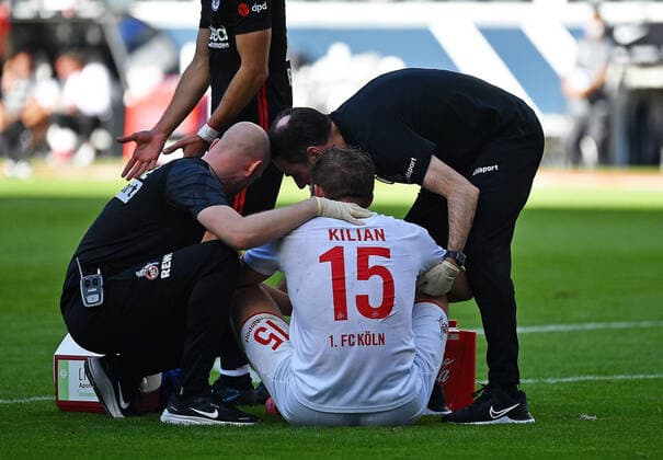 25 09 2021, xjhx, football 1 Bundesliga, Eintracht Frankfurt 1 FC Koeln emspor, v l Luca Kilian 1 FC Köln injured pain on the ground DFL DFB REGULATES PROHIBIT ANY USE OF PHOTOGRAPHS as IMAGE SEQUENCES and or QUASI VIDEO Frankfurt am Main