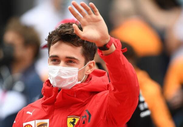6659890 26.09.2021 Scuderia Ferrari s Charles Leclerc waves during the drivers parade ahead of the race of the 2021 Formula One Russian Grand Prix at the Sochi Autodrom in Sochi, Russia. Vladimir Astapkovich Sputnik Russia Motor Formula 1 Race  5b13e0f7449ec7ae