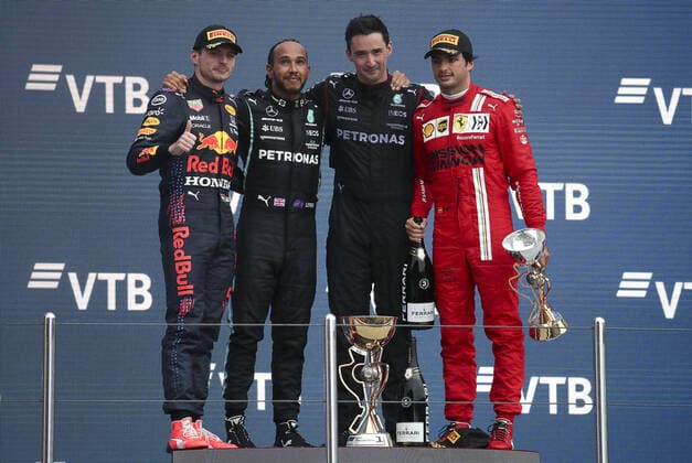 SOCHI, RUSSIA - SEPTEMBER 26, 2021: 2nd placed, Red Bull Racing F1 Team driver Max Verstappen, 1st placed Mercedes AMG Petronas F1 Team driver Lewis Hamilton (L-R) and 3rd placed, Scuderia Ferrari F1 Team driver Carlos Sainz (R) pose for a photograph during the podium ceremony for the 2021 Formula One Russian Grand Prix at the Sochi Autodrom racing circuit. Sergei Fadeichev TASS  TS112141
