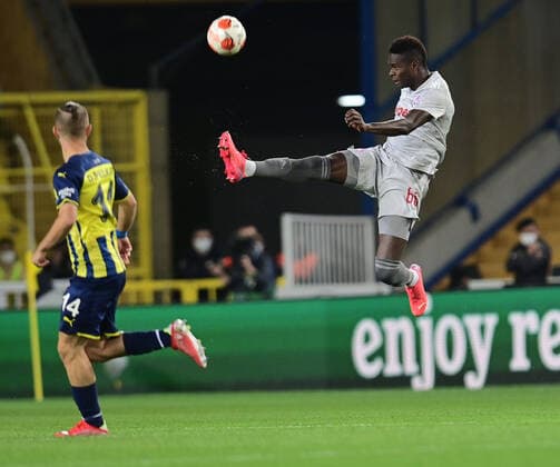 Dimitrios Pelkas of Fenerbahce and Pape Cisse (66) of Olympiakos during the UEFA Europa League Group D match between Fenerbahce and Olympiakos at Ulker Stadium in Istanbul , Turkey on September 30 , 2021. 