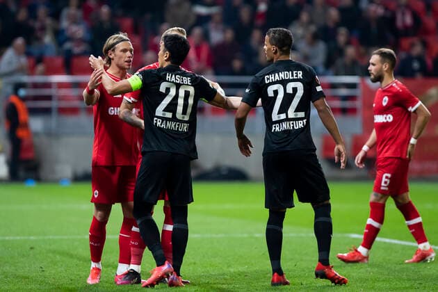 Antwerp s Viktor Fischer, Eintracht s Makoto Hasebe and Eintracht s Timothy Chandler pictured during a soccer game between Belgian Royal Antwerp FC and German Eindracht Frankfurt, Thursday 30 September 2021, in Antwerp, on the second day (out of six) of the Europa League group stage, in the Group D. KRISTOFxVANxACCOM  x3104104x