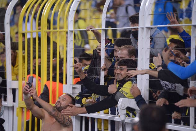Olympiakos player Mathieu Valbuena take a selfie with Fenerbahce s fans during the UEFA Europa League Group D match between Fenerbahce and Olympiakos at Ulker Stadium in Istanbul , Turkey on September 30 , 2021. 