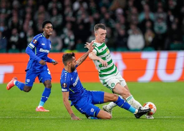 Mandatory Credit: Photo by Stuart Wallace Shutterstock (12516265ad) Kerem Demirbay of Bayer 04 Leverkusen tackles David Turnbull of Celtic Celtic v Bayer Leverkusen, UEFA Europa League, Group G, Football, Celtic Park, Glasgow, UK - 30 Sep 2021 EDITORIAL USE ONLY No use with unauthorised audio, video, data, fixture lists, club league logos or live services. Online in-match use limited to 120 images, no video emulation. No use in betting, games or single club league player publications. Celtic v Bayer Leverkusen, UEFA Europa League, Group G, Football, Celtic Park, Glasgow, UK - 30 Sep 2021 EDITORIAL USE ONLY No use with unauthorised audio, video, data, fixture lists, club league logos or live services. Online in-match use limited to 120 images, no video emulation. No use in betting, games or single club league player publications.  Copyright: xStuartxWallace Shutterstockx 12516265ad