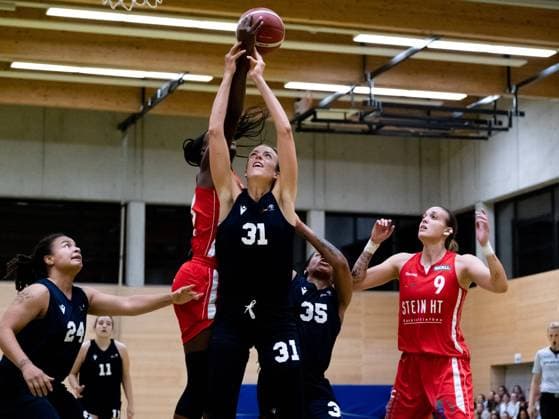 Duesseldorf, Germany, October 1s Britta Worms ( 31 Capitol Bascats ) and Nicole Enabosi ( 33 Herner TC ) both reach for the ball during the 1. Toyota Damen Basketball Bundesliga game between the Capitol Bascats Duesseldorf and Herner TC at Wekita Sportarena in Duesseldorf 1. Toyota Damen Basketball Bundesliga - Capitol Bascats Duesseld 