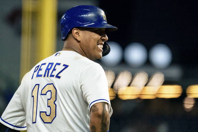 Kansas City Royals catcher Salvador Perez (13) smiles toward the Minnesota Twins dugout in the first inning at Kaufman Stadium in Kansas City, Missouri on Friday, October 1, 2021.  KCP20211001110 KYLExRIVAS