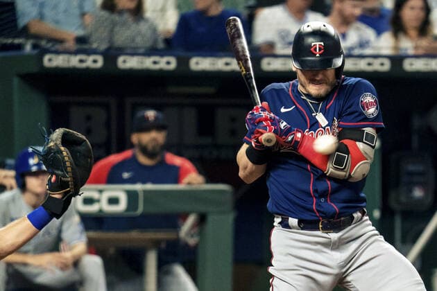 Minnesota Twins third baseman Josh Donaldson (20) is hit by a Kansas City Royals pitch in the sixth inning at Kaufman Stadium in Kansas City, Missouri on Friday, October 1, 2021.  KCP20211001118 KYLExRIVAS