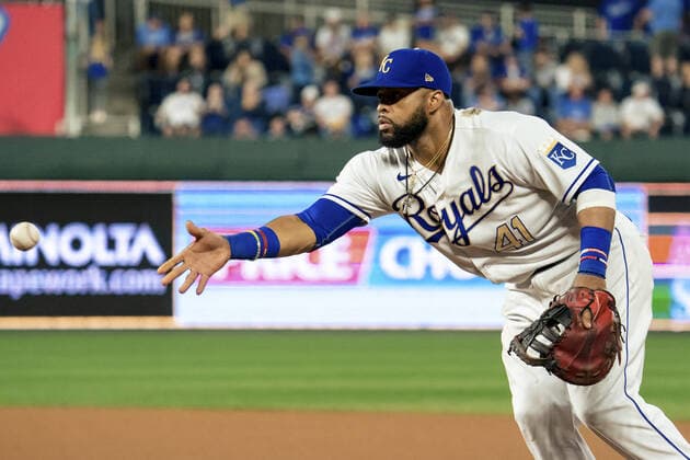 Kansas City Royals first baseman Carlos Santana (41) tosses throws a Minnesota Twins runner out at first base at Kaufman Stadium in Kansas City, Missouri on Friday, October 1, 2021.  KCP20211001122 KYLExRIVAS