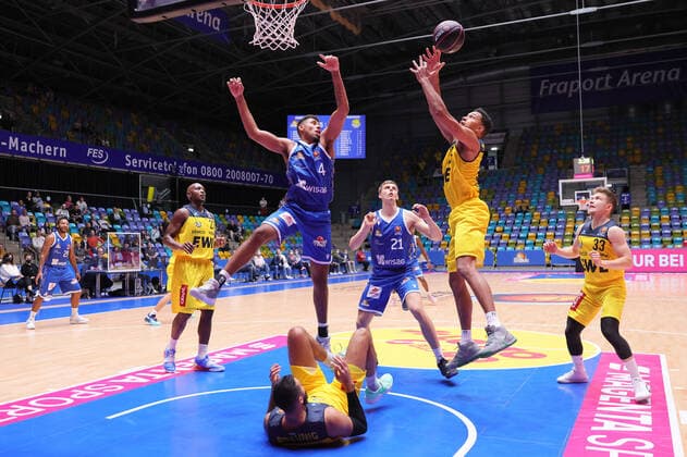 Fraport Skyliners EWE Baskets Oldenburg, BBL Pokal TJ Holyfield Baskets Oldenburg, 22 gets the rebound against Jordan Samare Fraport Skyliner, 4 Rewchts Bennet Hundt Baskets Oldenburg, 33 , left in the background Rickey Paulding Baskets Oldenburg, 23 and Lorenz Brenneke Fraport Skyliner, 21 Basketball match of the MagentaSport BBL Cup Round of 16 between Fraport Skyliners and EWE Baskets Oldenburg on 3 October 2021 at Fraport Arena in Frankfurt am Main , Frankfurt am Main Hesse Germany Fraport Arena