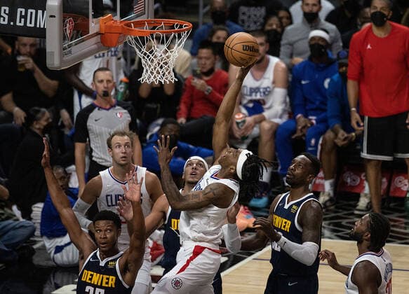 October 4, 2021, Los Angeles, California, USA: Terance Mann 14 of the Los Angeles Clippers goes for a dunk during their preseason NBA, Basketball Herren, USA game with the Denver Nuggets on Monday October 4, 2021 at the Staples Center in Los Angeles, California. Clippers defeat Nuggets, 103 - 102. PI Los Angeles USA - ZUMAp124 20211004_zaa_p124_005 Copyright: xJAVIERxROJASx