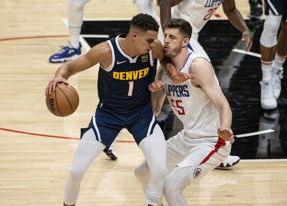October 4, 2021, Los Angeles, California, USA: Isaiah Hartenstein 55 of the Los Angeles Clippers defends against Michael Porter Jr. 1 of the Denver Nuggets during their preseason NBA, Basketball Herren, USA game on Monday October 4, 2021 at the Staples Center in Los Angeles, California. Clippers defeat Nuggets, 103 - 102. PI Los Angeles USA - ZUMAp124 20211004_zaa_p124_006 Copyright: xJAVIERxROJASx